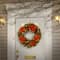 24" Decorative Collection Hydrangea Wreath with Cones, Red Berries & 50ct. Soft White Battery Operated LED Lights with Timer